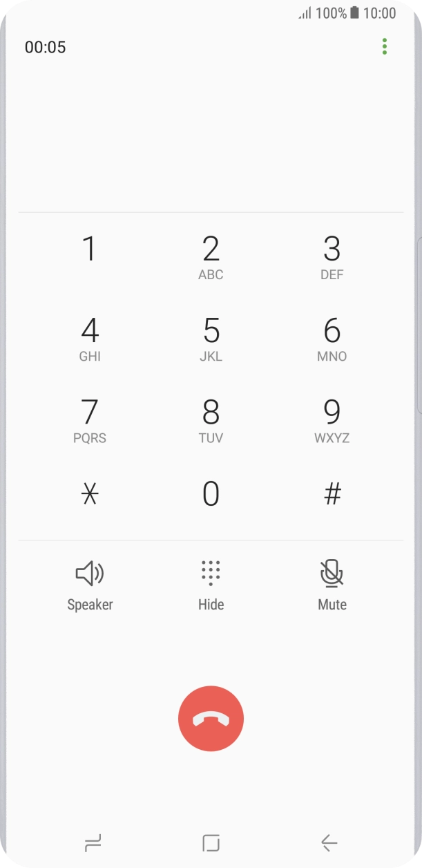 Press the end call icon.