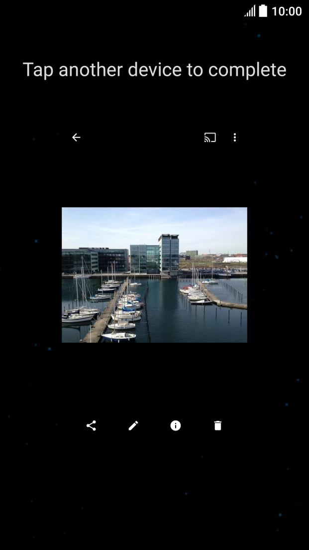 Hold the back of your phone close to back of the receiving device. Press Tap another device to complete and wait while the file is transferred.