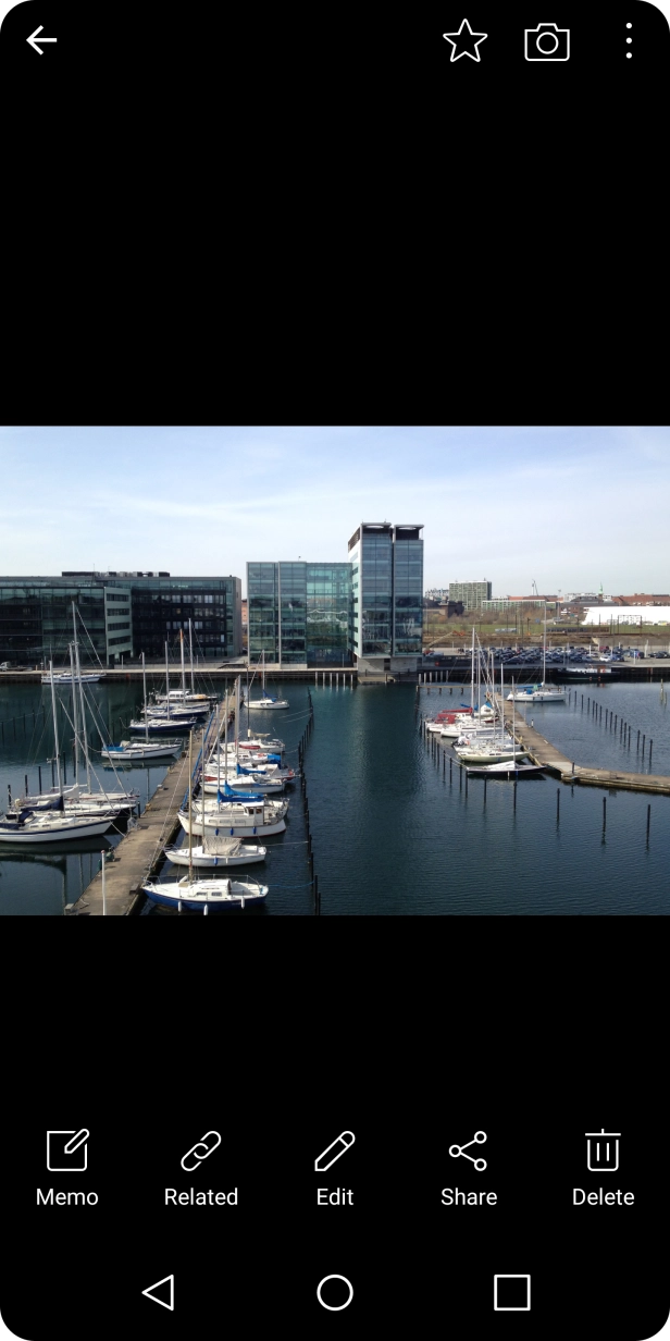 Press the Return key to return to the list of pictures and video clips.