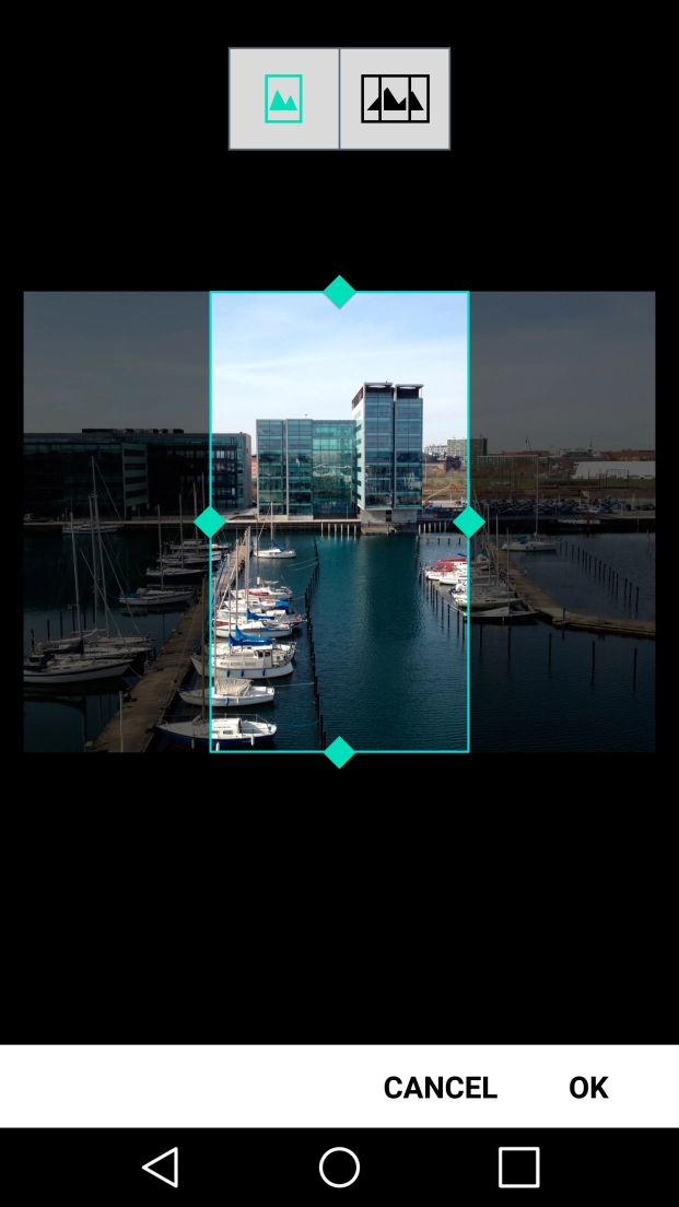 Drag two fingers together or apart to zoom in or out and press OK.