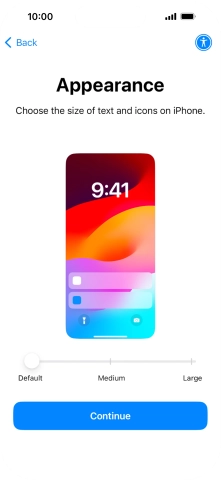 Select the required text and icon size on your phone and press Continue.