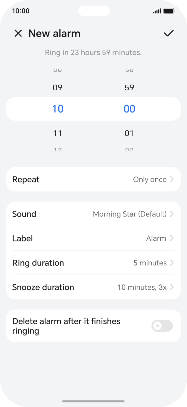 Slide your finger up or down on the hour and minute numbers to set the required alarm time.