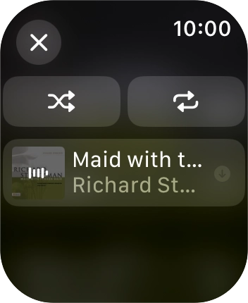 Prima o ícone de reprodução aleatória.