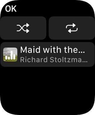 Prima o ícone de reprodução aleatória.