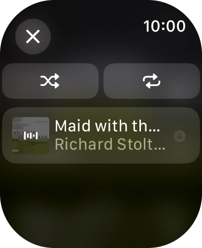 Prima o ícone de reprodução aleatória.