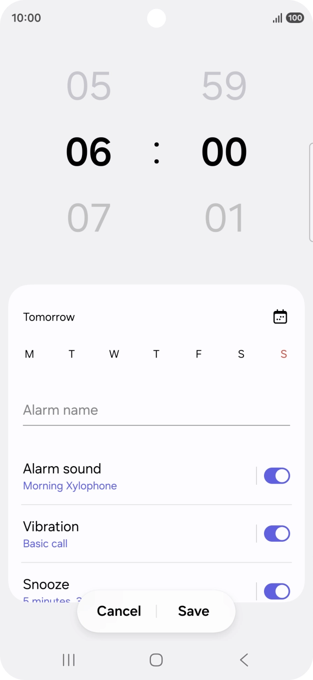 Slide your finger up or down on the hour and minute numbers to set the required alarm time.
