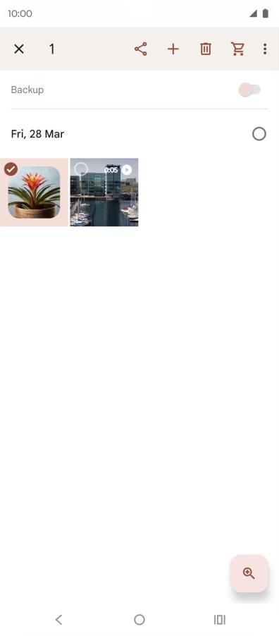 Press the required pictures or videos to select them.