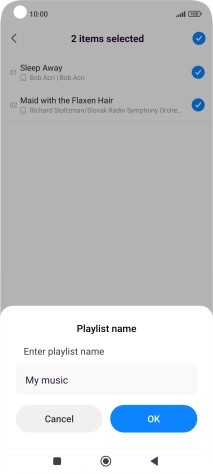 Key in a name for the playlist and press OK. Key in a name for the playlist and press OK.