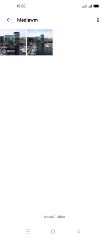 Press and hold the required picture or video clip. Press and hold the required picture or video clip.