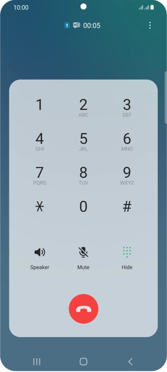 Press the end call icon.
