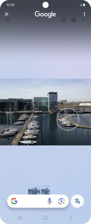 Draw a circle around the required object on the picture and wait for the search results.