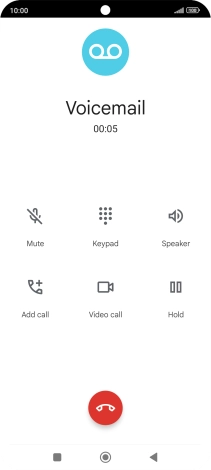 Press the end call icon.