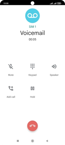 Press the end call icon.