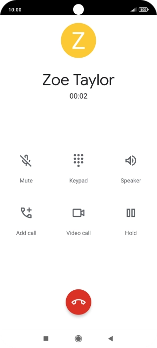 Press the end call icon.
