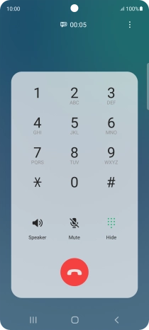 Press the end call icon.
