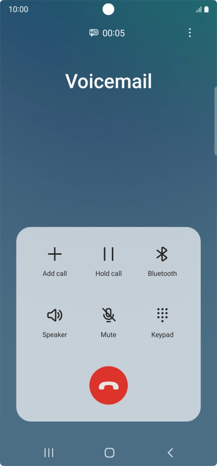 Press the end call icon.