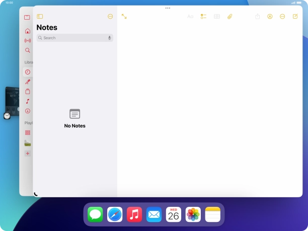 Press the required application in Dock and drag it to the required location on the screen.