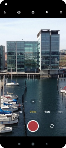 If the video recorder is turned on, press Photo.