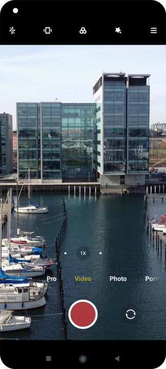 If the video recorder is turned on, press Photo.