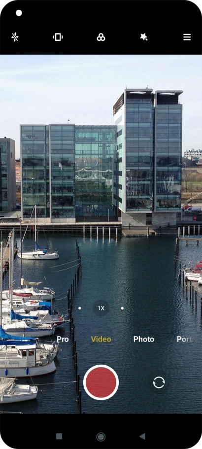 If the video recorder is turned on, press Photo.