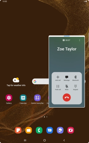 Press the end call icon.