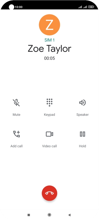 Press the end call icon.
