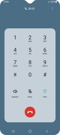 Press the end call icon.