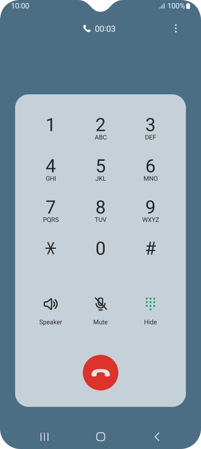 Press the end call icon.