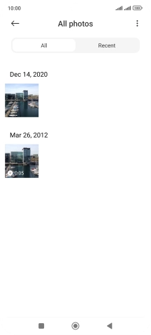 Press and hold the required picture or video clip. Press and hold the required picture or video clip.