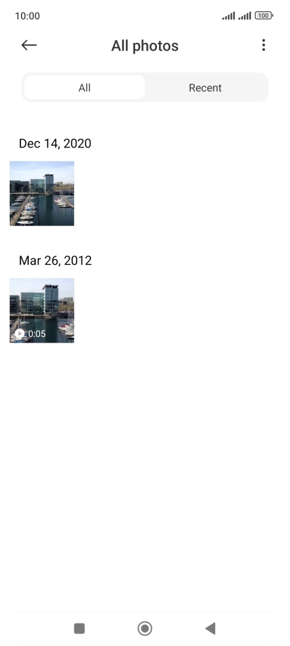 Press and hold the required picture or video clip. Press and hold the required picture or video clip.