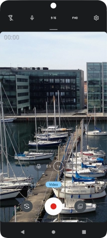 If the video recorder is turned on, press Photo.