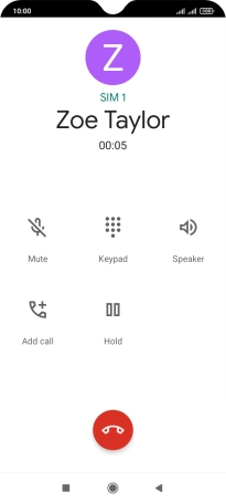 Press the end call icon.