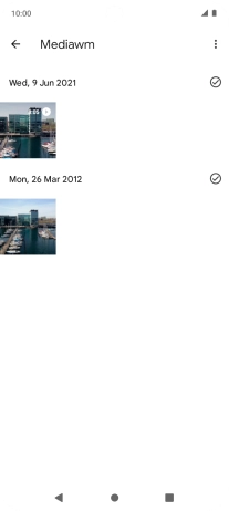 Press and hold the required picture or video clip. Press and hold the required picture or video clip.