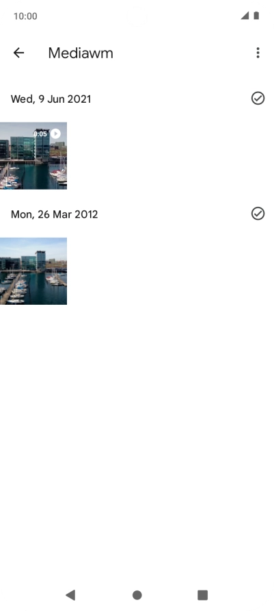Press and hold the required picture or video clip. Press and hold the required picture or video clip.