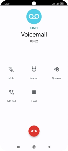 Press the end call icon.