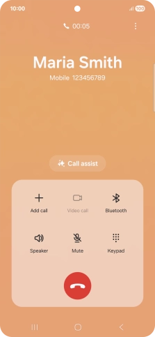 Press the end call icon.
