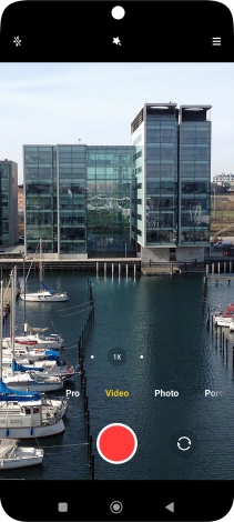 If the video recorder is turned on, press Photo.