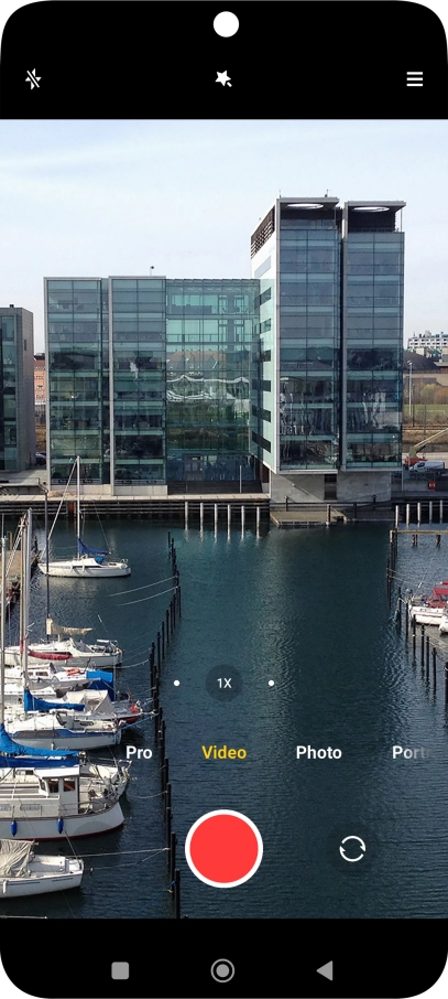 If the video recorder is turned on, press Photo.