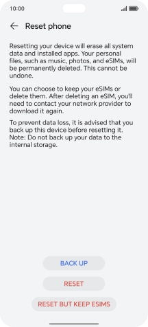 Press RESET. Wait a moment while the factory default settings are restored. Follow the instructions on the screen to set up your phone and prepare it for use.