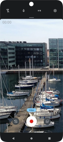 If the video recorder is turned on, press Photo.