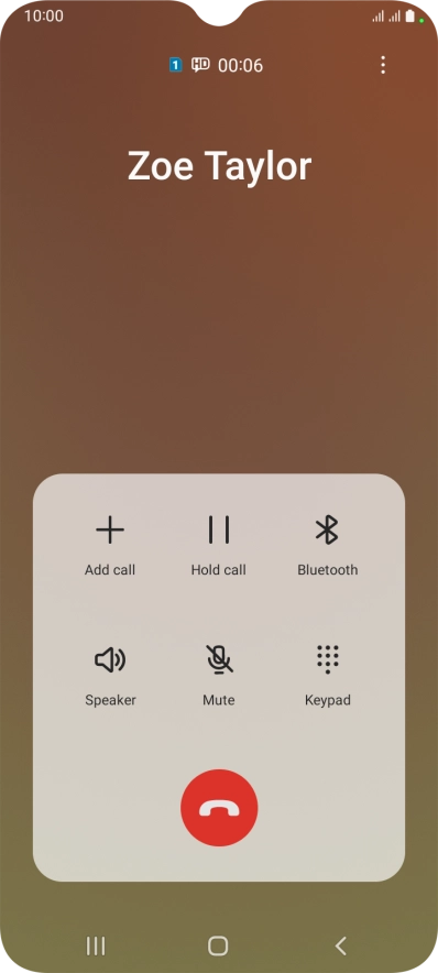 Press the end call icon.