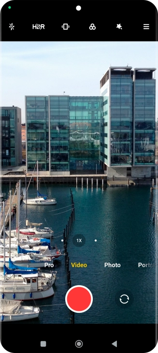 If the video recorder is turned on, press Photo.