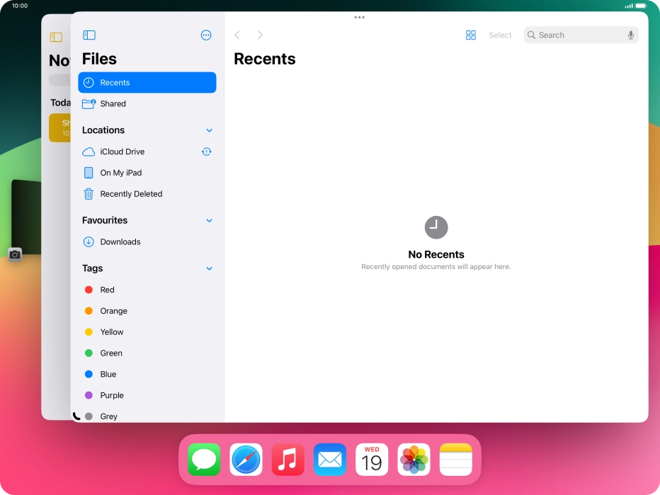Press the required application in Dock and drag it to the required location on the screen.