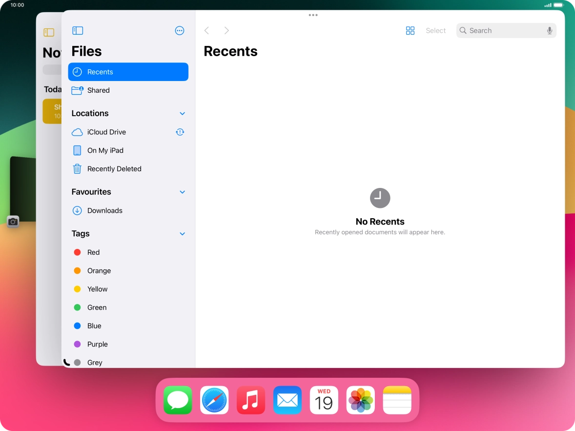 Press the required application in Dock and drag it to the required location on the screen.