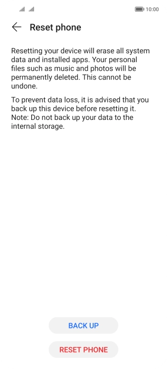 Press RESET PHONE. Wait a moment while the factory default settings are restored. Follow the instructions on the screen to set up your phone and prepare it for use.