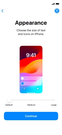 Select the required text and icon size on your phone and press Continue.