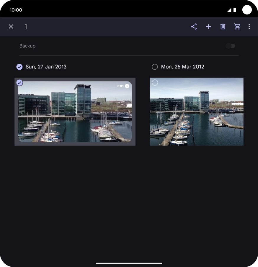 Press the required pictures or videos to select them.