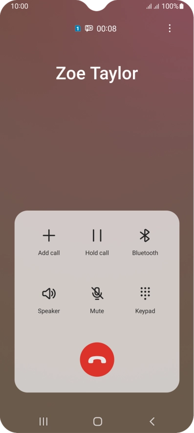 Press the end call icon.