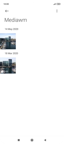 Press and hold the required picture or video clip. Press and hold the required picture or video clip.