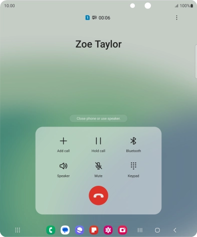 Press the end call icon.